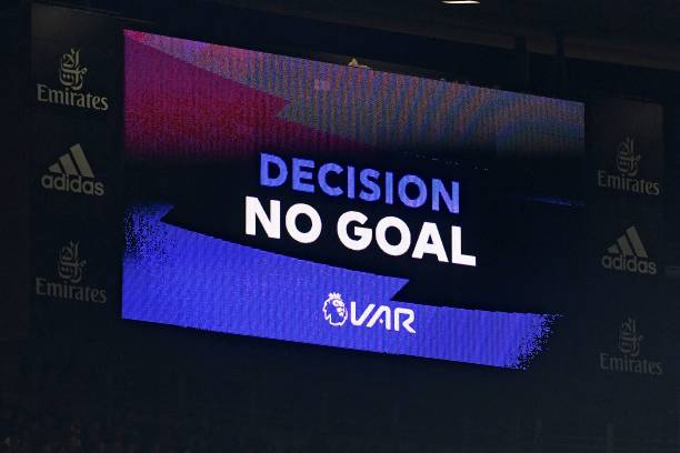 The scoreboard displays the VAR (Video Assistant Referee) decision disallowing Arsenal's third goal by Arsenal's Greek defender Sokratis Papastatho...