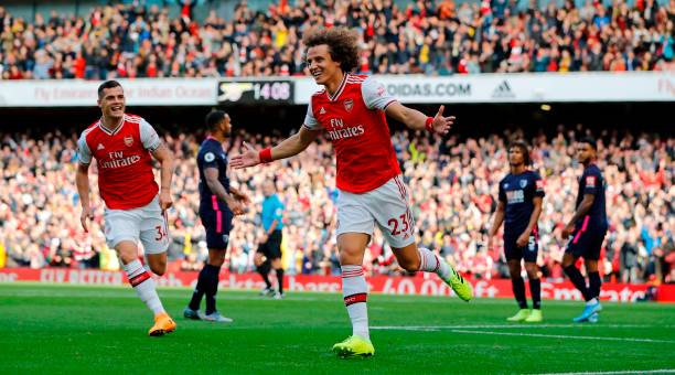 Hot take: Why does Arsenal winning feel so bad? 3 Asenal's Brazilian defender David Luiz (C) celebrates after scoring the opening goal of the English Premier League football match between Arsenal and Bournemouth at the Emirates Stadium in London on October 6, 2019. (Photo by Tolga AKMEN / AFP)
