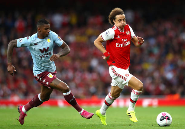 LONDON, ENGLAND - SEPTEMBER 22: David Luiz of Arsenal battles for possession with Wesley of Aston Villa during the Premier League match between Arsenal FC and Aston Villa at Emirates Stadium on September 22, 2019 in London, United Kingdom. (Photo by Michael Steele/Getty Images)