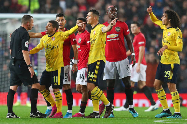 Arsenal booked every 3 fouls, Liverpool every 10 2 MANCHESTER, ENGLAND - SEPTEMBER 30: Players react towards the match Referee Kevin Friend during the Premier League match between Manchester United and Arsenal FC at Old Trafford on September 30, 2019 in Manchester, United Kingdom. (Photo by Catherine Ivill/Getty Images)