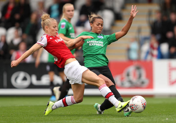 BOREHAMWOOD, ENGLAND - SEPTEMBER 29: Leonie Maier of Arsenal and Fern Whelan of Brighton & Hove Albion battle for the ball during the Barclays FA Women's Super League match between Arsenal and Brighton & Hove Albion at Meadow Park on September 29, 2019 in Borehamwood, United Kingdom. (Photo by Kate McShane/Getty Images)