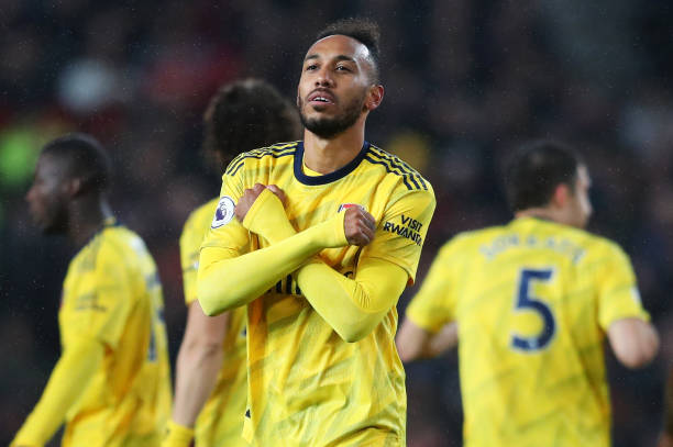 MANCHESTER, ENGLAND - SEPTEMBER 30: Pierre-Emerick Aubameyang of Arsenal celebrates after scoring his team's first goal during the Premier League m...