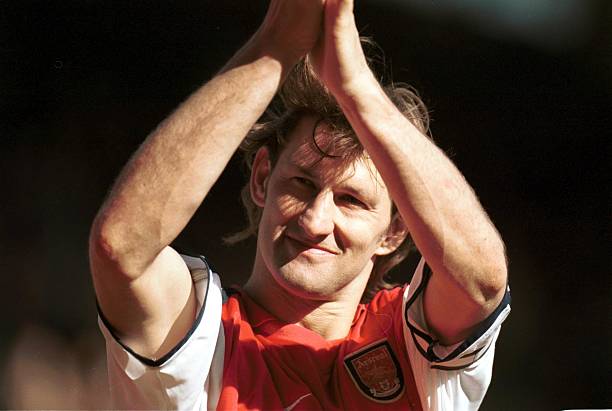 5 May 2001: Captain Tony Adams of Arsenal applauds the crowd as Arsenal qualify for next years Champions League after the match between Arsenal v L...
