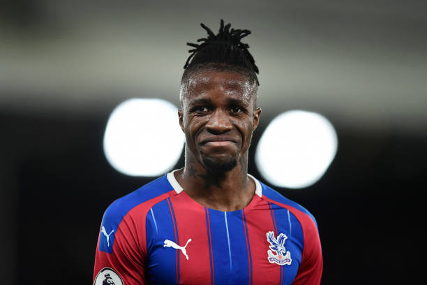 LONDON, ENGLAND - OCTOBER 19: Wilfried Zaha of Crystal Palace reacts during the Premier League match between Crystal Palace and Manchester City at ...