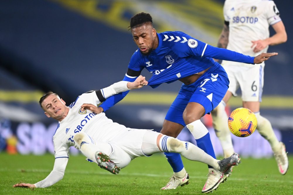 Leeds United's Macedonian midfielder Ezgjan Alioski (L) vies with Everton's Nigerian midfielder Alex Iwobi (R) during the English Premier League fo...
