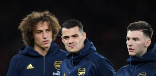 LONDON, ENGLAND - NOVEMBER 28: (L-R) David Luiz, Granit Xhaka and Kieran Tierney of Arsenal look on they line up ahead of the UEFA Europa League group F match between Arsenal FC and Eintracht Frankfurt at Emirates Stadium on November 28, 2019 in London, United Kingdom. (Photo by Shaun Botterill/Getty Images)