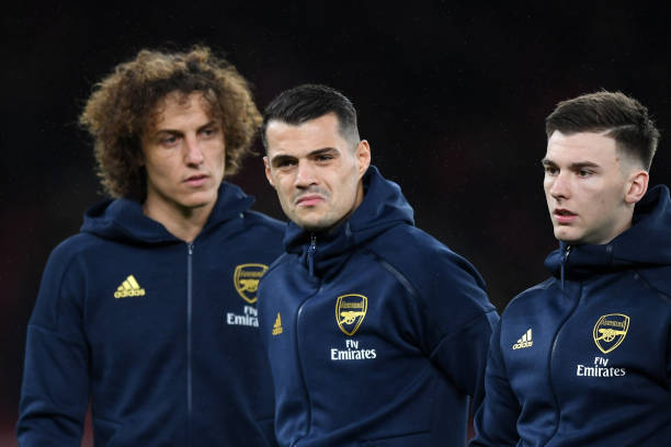 22 things I noticed as Arsenal bring back the banter era against Norwich 4 LONDON, ENGLAND - NOVEMBER 28: (L-R) David Luiz, Granit Xhaka and Kieran Tierney of Arsenal look on they line up ahead of the UEFA Europa League group F match between Arsenal FC and Eintracht Frankfurt at Emirates Stadium on November 28, 2019 in London, United Kingdom. (Photo by Shaun Botterill/Getty Images)