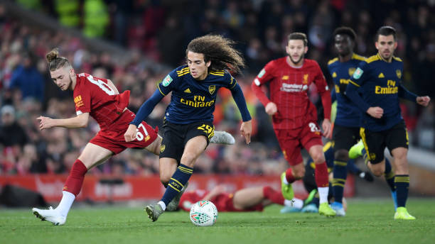 LIVERPOOL, ENGLAND - OCTOBER 30: Matteo Guendouzi of Arsenal is challenged by Harvey Elliott of Liverpool during the Carabao Cup Round of 16 match ...