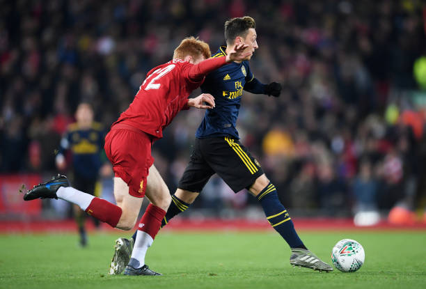 4 best and 2 worst: Arsenal October player ratings 5 LIVERPOOL, ENGLAND - OCTOBER 30: Mesut Ozil of Arsenal is challenged by Sepp Van Den Berg of Liverpool during the Carabao Cup Round of 16 match between Liverpool and Arsenal at Anfield on October 30, 2019 in Liverpool, England. (Photo by Laurence Griffiths/Getty Images)