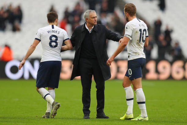 LONDON, ENGLAND - NOVEMBER 23: Jose Mourinho, Manager of Tottenham Hotspur embraces Harry Winks and Harry Kane of Tottenham Hotspur after the Premi...