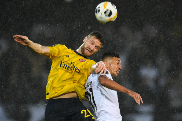 Hot take: Why won't the Arsenal board sack Unai Emery? 5 GUIMARAES, PORTUGAL - NOVEMBER 06: Shkodran Mustafi of Arsenal battles for possession with in the air with Davidson of Vitoria Guimaraes during the UEFA Europa League group F match between Vitoria Guimaraes and Arsenal FC at Estadio Dom Afonso Henriques on November 06, 2019 in Guimaraes, Portugal. (Photo by Octavio Passos/Getty Images)