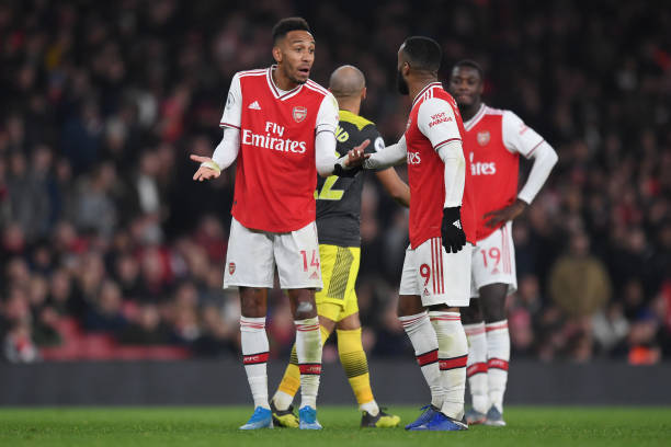 Can Arsenal keep Aubameyang if Barcelona come calling? 2 LONDON, ENGLAND - NOVEMBER 23: Pierre-Emerick Aubameyang of Arsenal talks to Alexandre Lacazette of Arsenal during the Premier League match between Arsenal FC and Southampton FC at Emirates Stadium on November 23, 2019 in London, United Kingdom. (Photo by Shaun Botterill/Getty Images)