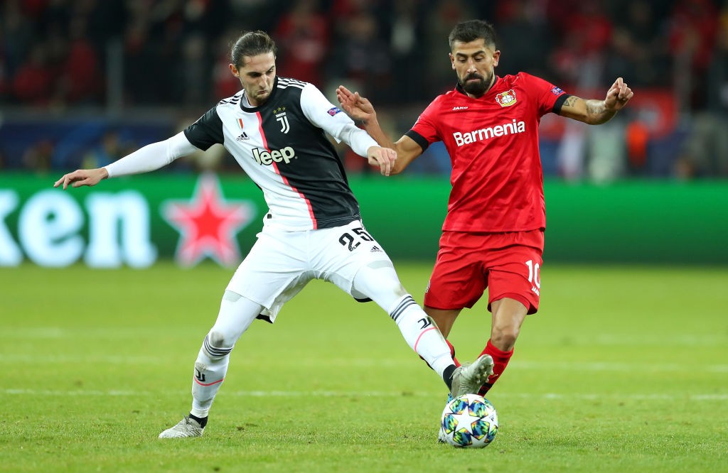 LEVERKUSEN, GERMANY - DECEMBER 11: Kerem Demirbay of Bayer 04 Leverkusen (R) is challenged by Adrien Rabiot of Juventus during the UEFA Champions League group D match between Bayer Leverkusen and Juventus at BayArena on December 11, 2019, in Leverkusen, Germany. (Photo by Lars Baron/Getty Images)