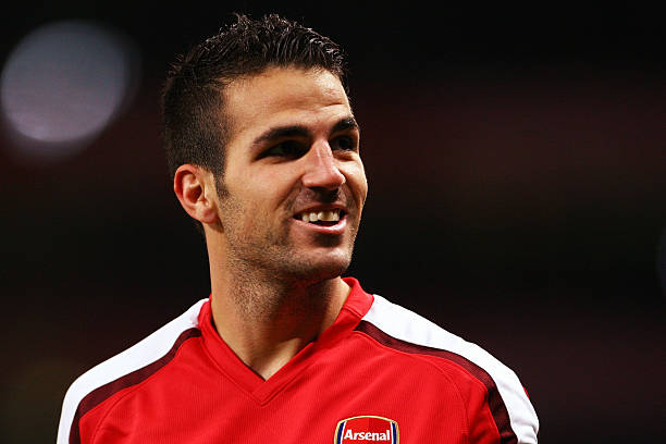 LONDON, ENGLAND - NOVEMBER 04: Cesc Fabregas of Arsenal celebrates scoring his second and the teams the third goal of the game during the UEFA Cham...