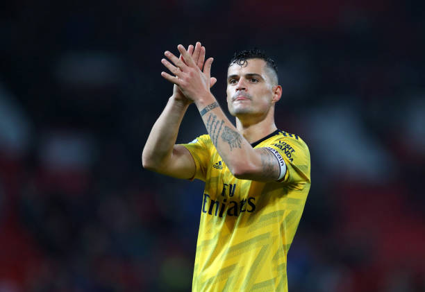 MANCHESTER, ENGLAND - SEPTEMBER 30: Granit Xhaka of Arsenal applauds after the Premier League match between Manchester United and Arsenal FC at Old...
