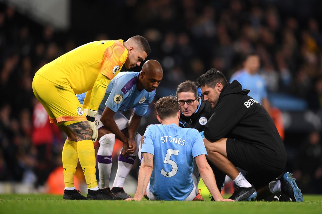 John Stones, David Silva and Sergio Aguero miss training with injury 2 MANCHESTER, ENGLAND - DECEMBER 07: John Stones of Manchester City receives medical treatment during the Premier League match between Manchester City and Manchester United at Etihad Stadium on December 07, 2019, in Manchester, United Kingdom. (Photo by Laurence Griffiths/Getty Images)