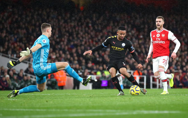 LONDON, ENGLAND - DECEMBER 15: Bernd Leno of Arsenal makes a save from Gabriel Jesus of Manchester City during the Premier League match between Arsenal FC and Manchester City at Emirates Stadium on December 15, 2019 in London, United Kingdom. (Photo by Julian Finney/Getty Images)