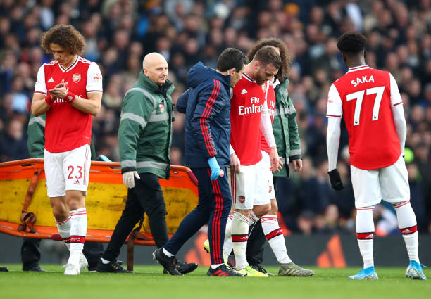 LONDON, ENGLAND - DECEMBER 29: Callum Chambers of Arsenal leaves the pitch following an injury during the Premier League match between Arsenal FC a...