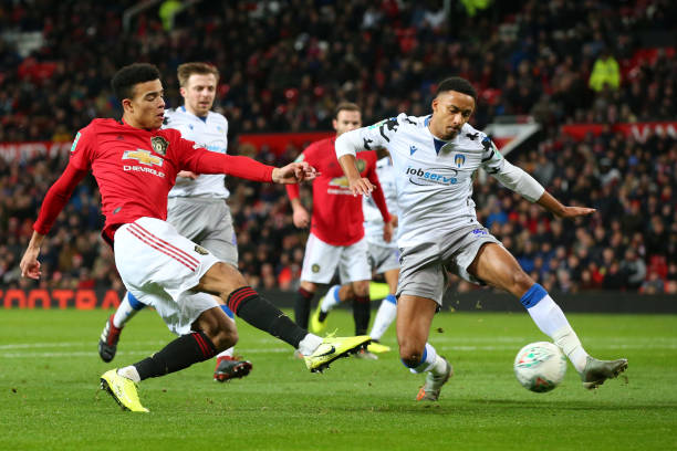Cardiff City consider move for 'crucial' Cohen Bramall 2 MANCHESTER, ENGLAND - DECEMBER 18: Mason Greenwood of Manchester United shoots while challenged by Cohen Bramall of Colchester United during the Carabao Cup Quarter Final match between Manchester United and Colchester United at Old Trafford on December 18, 2019 in Manchester, England. (Photo by Alex Livesey/Getty Images)