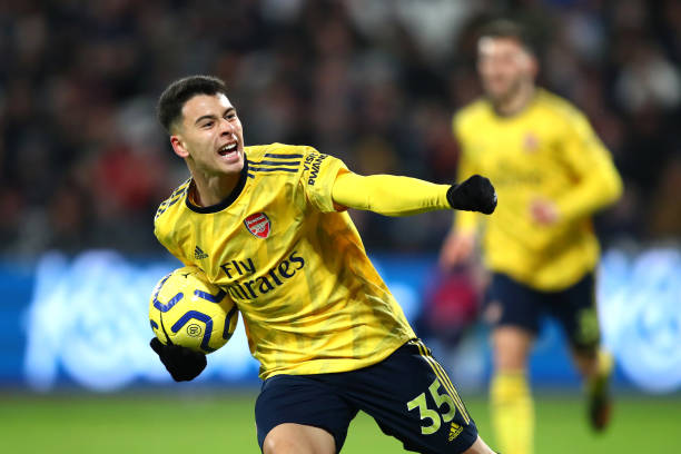 LONDON, ENGLAND - DECEMBER 09: Gabriel Martinelli of Arsenal celebrates after scoring his sides first goal during the Premier League match between West Ham United and Arsenal FC at London Stadium on December 09, 2019 in London, United Kingdom. (Photo by Julian Finney/Getty Images)