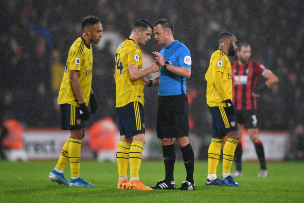 BOURNEMOUTH, ENGLAND - DECEMBER 26: Match referee Stuart Attwell speaks to Granit Xhaka of Arsenal during the Premier League match between AFC Bour...