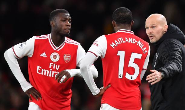 Will Arsenal sell Ainsley Maitland-Niles to Tottenham Hotspur? 3 Arsenal's Swedish Interim head coach Freddie Ljungberg (R) speaks with Arsenal's French-born Ivorian midfielder Nicolas Pepe (L) and Arsenal's English midfielder Ainsley Maitland-Niles during the English Premier League football match between Arsenal and Manchester City at the Emirates Stadium in London on December 15, 2019. (Photo by Ben STANSALL / AFP)