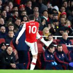 LONDON, ENGLAND - DECEMBER 15: Mesut Ozil of Arsenal kicks a water bottle as he is subbed as Interim Manager of Arsenal, Freddie Ljungberg looks on during the Premier League match between Arsenal FC and Manchester City at Emirates Stadium on December 15, 2019 in London, United Kingdom. (Photo by Julian Finney/Getty Images)