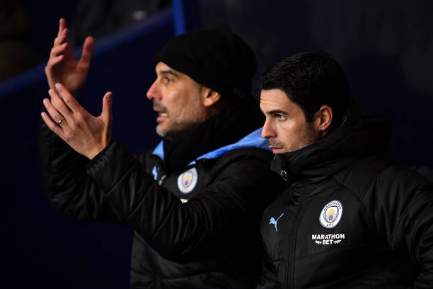 OXFORD, ENGLAND - DECEMBER 18: Mikel Arteta, Assistant Manager of Manchester City looks on as Manager of Manchester City, Josep Guardiola reacts du...