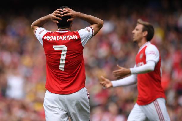 Arsenal's Armenian midfielder Henrikh Mkhitaryan (L) and Arsenal's Spanish defender Nacho Monreal (R) react to another missed chance during the pre...