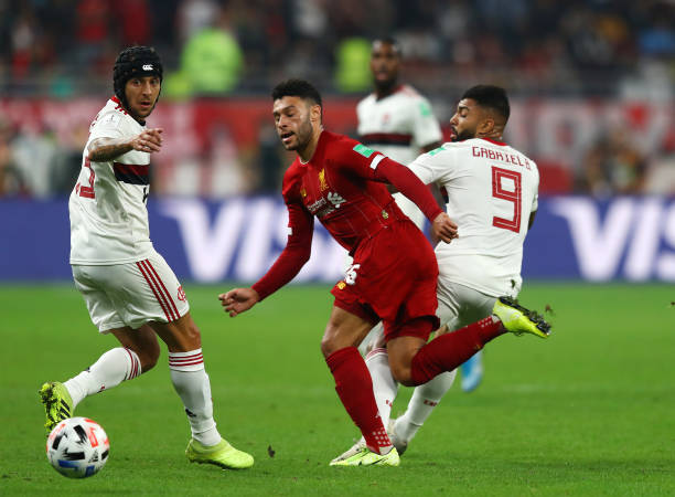 DOHA, QATAR - DECEMBER 21: Alex Oxlade-Chamberlain of Liverpool battles for possession with Gabriel Barbosa of CR Flamengo during the FIFA Club Wor...