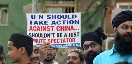 Indian Muslims hold placards as they protest to denounce the Chinese government's policies for Uighur Muslims in Xinjiang, in Mumbai on December 9, 2019. (Photo by Punit PARANJPE / AFP) (Photo by PUNIT PARANJPE/AFP via Getty Images)