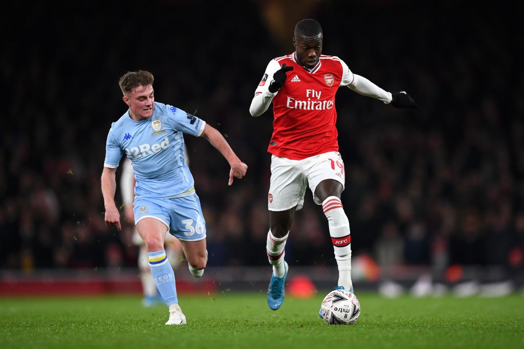 LONDON, ENGLAND - JANUARY 06: Nicolas Pepe of Arsenal makes a break past Robbie Gotts of Leeds United during the FA Cup Third Round match between Arsenal FC and Leeds United at the Emirates Stadium on January 06, 2020, in London, England. (Photo by Shaun Botterill/Getty Images)
