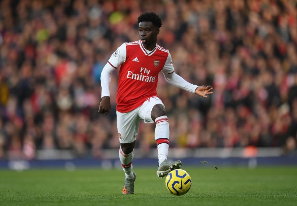LONDON, ENGLAND - JANUARY 18: Bukayo Saka of Arsenal runs with the ball during the Premier League match between Arsenal FC and Sheffield United at ...