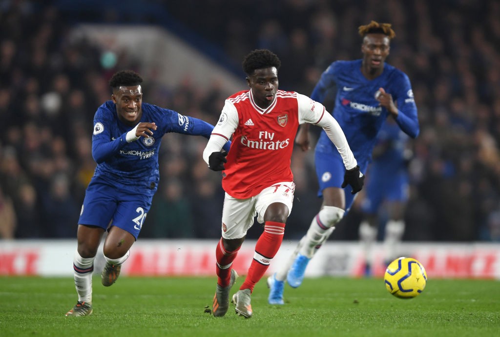 Arsenal track Chelsea winger for summer move 3 LONDON, ENGLAND - JANUARY 21: Bukayo Saka of Arsenal breaks away from Callum Hudson-Odoi of Chelsea during the Premier League match between Chelsea FC and Arsenal FC at Stamford Bridge on January 21, 2020, in London, United Kingdom. (Photo by Mike Hewitt/Getty Images)