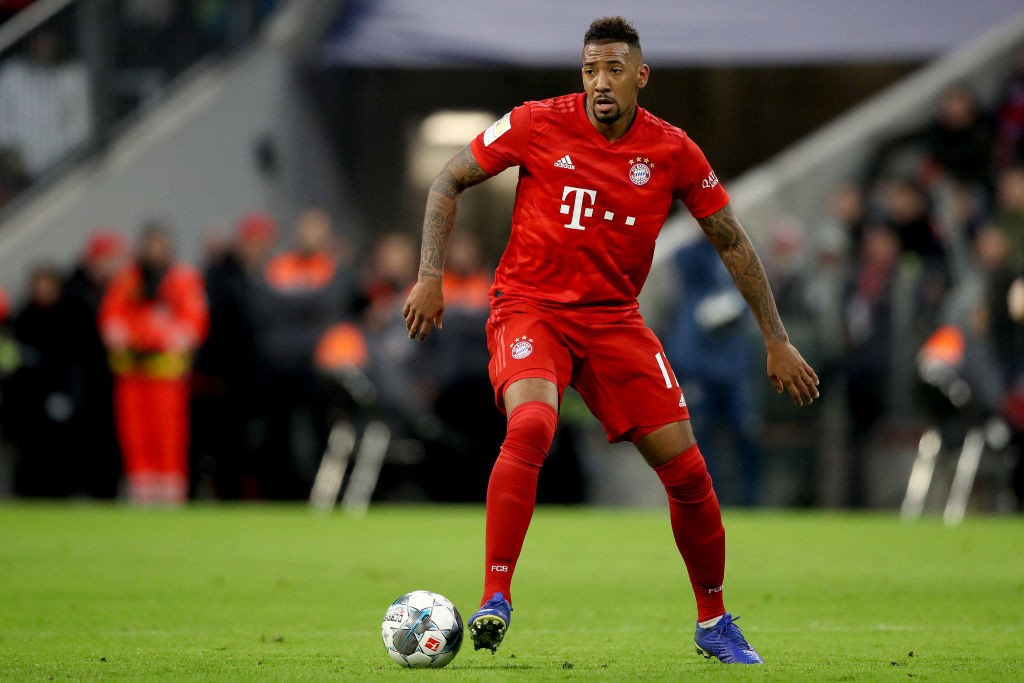 MUNICH, GERMANY - DECEMBER 14: Jerome Boateng of FC Bayern Muenchen runs with the ball during the Bundesliga match between FC Bayern Muenchen and S...