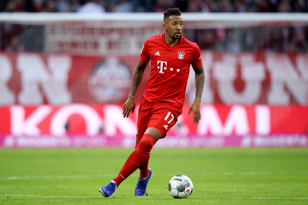 MUNICH, GERMANY - DECEMBER 14: Jerome Boateng of FC Bayern Muenchen runs with the ball during the Bundesliga match between FC Bayern Muenchen and S...
