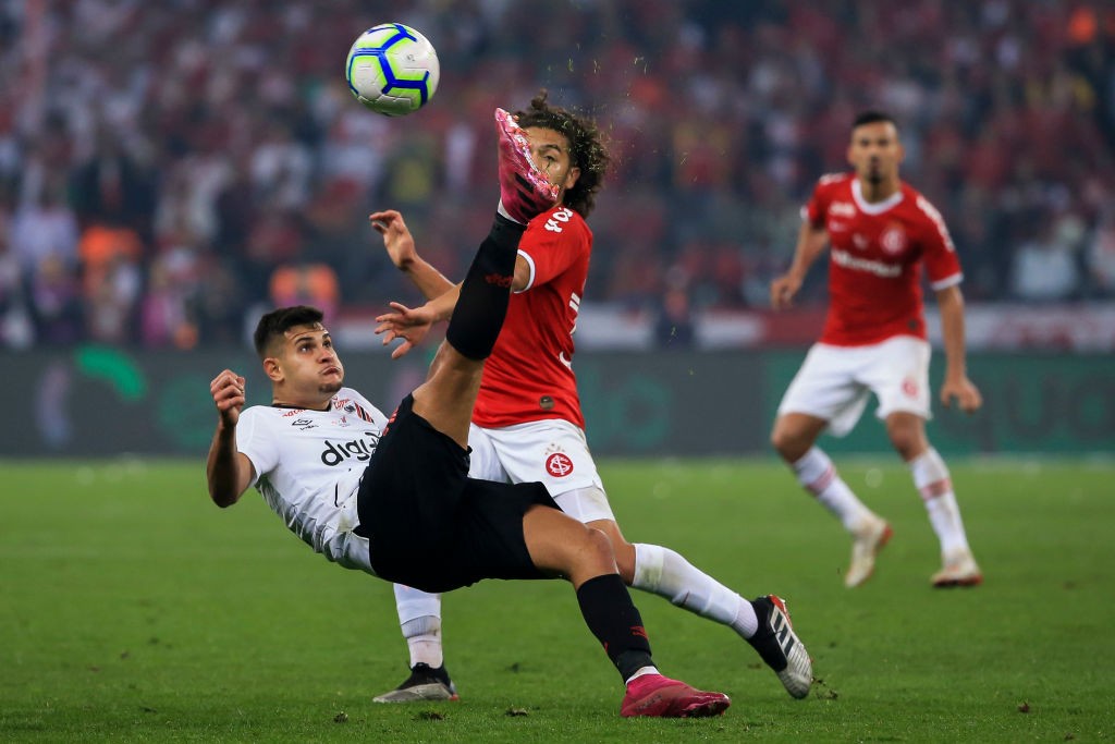 Lyon bid €22m for Arsenal-linked Bruno Guimaraes 2 PORTO ALEGRE, BRAZIL - SEPTEMBER 18: Bruno Guimaraes (L) of Athletico PR makes an overhead kick against a Nonato of Internacional during a match between Internacional and Athletico Paranaense as part of Copa do Brasil 2019 Finals at Beira-Rio Stadium on September 18, 2019, in Porto Alegre, Brazil. (Photo by Bruna Prado/Getty Images)
