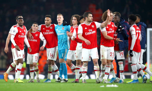 LONDON, ENGLAND - JANUARY 01: Lucas Torreira, Pierre-Emerick Aubameyang, Bernd Leno of Arsenal celebrate victory with their team mates after the Pr...