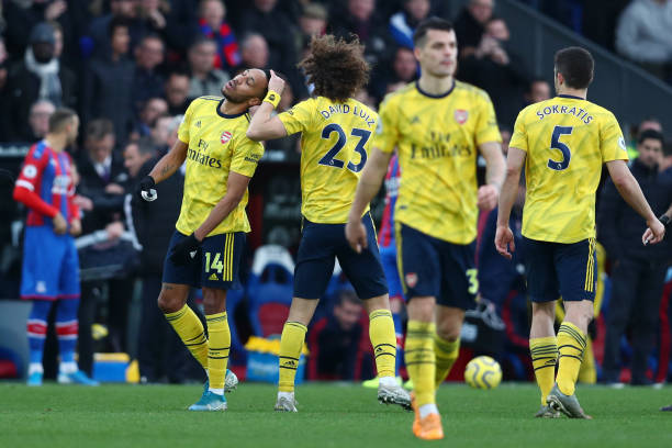 Pierre-Emerick Aubameyang apologises to Max Meyer for red card tackle 2 LONDON, ENGLAND - JANUARY 11: David Luiz of Arsenal consoles Pierre-Emerick Aubameyang of Arsenal after he receives a red card following a VAR decision during the Premier League match between Crystal Palace and Arsenal FC at Selhurst Park on January 11, 2020 in London, United Kingdom. (Photo by Dan Istitene/Getty Images)