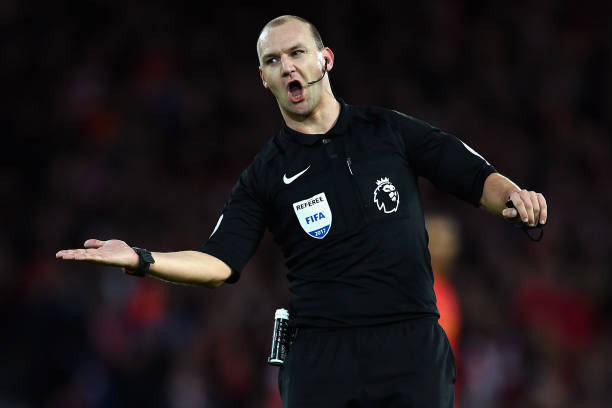 LIVERPOOL, ENGLAND - MARCH 04: Referee Robert Madley gestures during the Premier League match between Liverpool and Arsenal at Anfield on March 4, ...