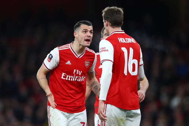 LONDON, ENGLAND - JANUARY 06: Granit Xhaka of Arsenal (L) argues with Rob Holding of Arsenal during the FA Cup Third Round match between Arsenal FC...