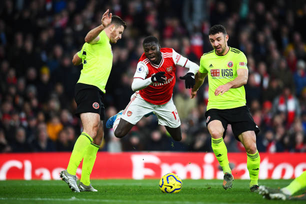 Horror refereeing team combine to rob Arsenal of win against Sheffield United 3 LONDON, ENGLAND - JANUARY 18: Nicolas Pepe of Arsenal is tackled by Enda Stevens of Sheffield United during the Premier League match between Arsenal FC and Sheffield United at Emirates Stadium on January 18, 2020 in London, United Kingdom. (Photo by Clive Mason/Getty Images)