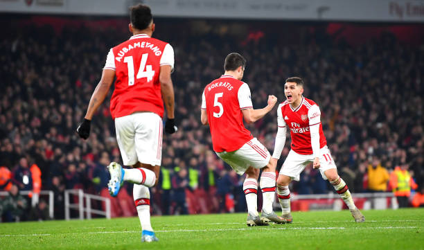 I'm 100% here: Aubameyang says he's going nowhere 3 LONDON, ENGLAND - JANUARY 01: Sokratis Papastathopoulos of Arsenal celebrates with Lucas Torreira of Arsenal after scoring his team's second goal during the Premier League match between Arsenal FC and Manchester United at Emirates Stadium on January 01, 2020 in London, United Kingdom. (Photo by Clive Mason/Getty Images)