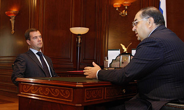 Russian President Dmitry Medvedev (L) speaks with Russian billionaire businessman Alisher Usmanov during their meeting in the residence of Gorki outside Moscow on September 9, 2008. Russian troops will stay in the rebel regions of Abkhazia and South Ossetia for a "long time" despite a vow to pull back from the rest of Georgia, Russian Foreign Minister Sergei Lavrov said. Usmanov has risen to greater prominence in Russia and abroad in recent months, notably buying a stake in Britain's Arsenal football club. AFP PHOTO /RIA NOVOSTI / KREMLIN POOL / DMITRY ASTAKHOV
