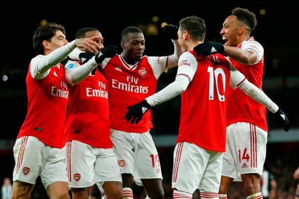 Arsenal Player Ratings vs Newcastle United 6 Arsenal's German midfielder Mesut Ozil (2nd R) celebrates with teammates after scoring their third goal during the English Premier League football match between Arsenal and Newcastle United at the Emirates Stadium in London on February 16, 2020.