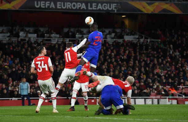 Ousseynou Ba of Olympiacos FC heads wide during the UEFA Europa League round of 32 second leg match between Arsenal FC and Olympiacos FC at Emirate...