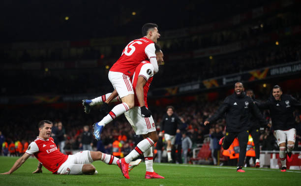 Pierre-Emerick Aubameyang of Arsenal FC celebrates with Gabriel Martinelli after scoring his team's first goal in extra-time during the UEFA Europa League round of 32 second leg match between Arsenal FC and Olympiacos FC at Emirates Stadium on February 27, 2020 in London, United Kingdom.