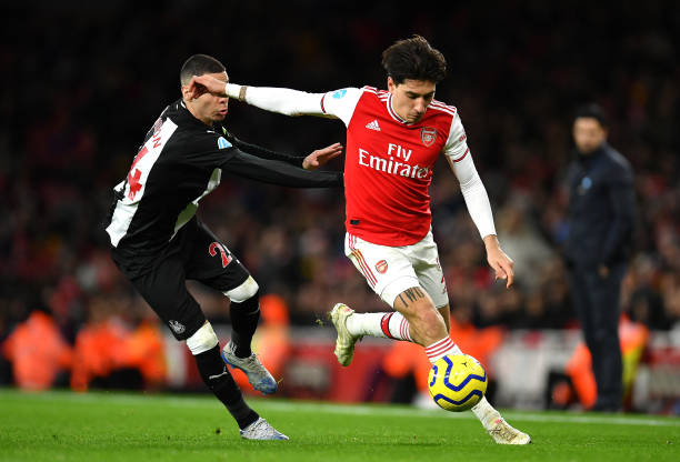 Hector Bellerin of Arsenal takes on Miguel Almiron of Newcastle United during the Premier League match between Arsenal FC and Newcastle United at E...