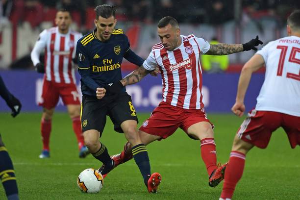 Arsenal's Spanish midfielder Dani Ceballos is fouled by Olympiakos' Brazilian midfielder Guilherme (R) during the UEFA Europa League round of 32 first leg football match between Olympiakos and Arsenal at the Karaiskakis Stadium in Piraeus, near Athens, on February 20, 2020.