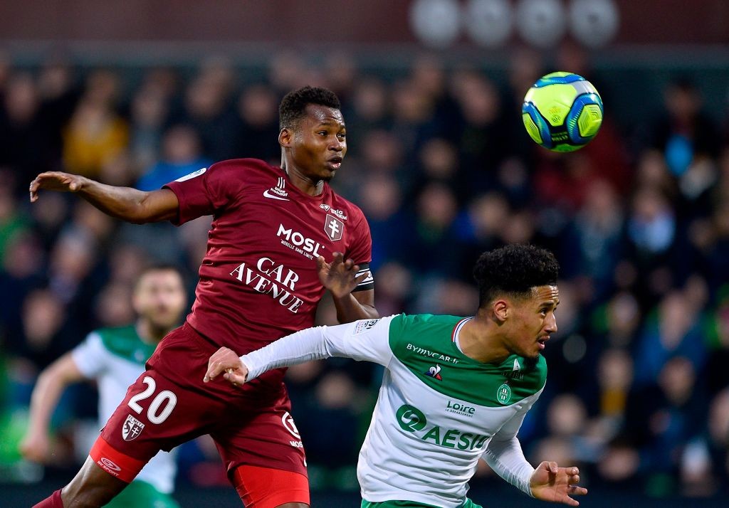 Metz' Senegalese forward Habib Diallo (L) vies with Saint-Etienne's French defender William Saliba during the French L1 football match between Metz...